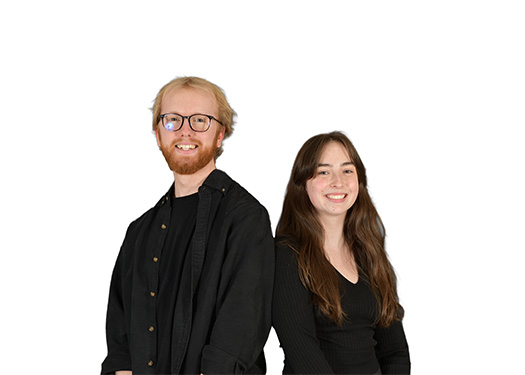 Smiling young person with glasses and blond hair standing back-to-back with smiling young woman with long brown hair.